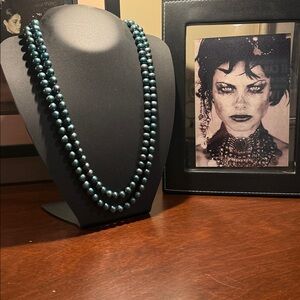 Gorgeous, strand of teal pearls !